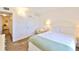 Bright bedroom features neutral tones, plush carpet, and comfortable furnishings for a relaxing retreat at 8931 Blind Pass Rd # 262, St Pete Beach, FL 33706