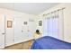 Cozy bedroom featuring carpet floors, neutral walls and light-blocking curtains at 8931 Blind Pass Rd # 262, St Pete Beach, FL 33706
