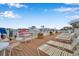Relaxing boat dock featuring lounge chairs, tables, and boats, perfect for enjoying waterfront living and scenic views at 8931 Blind Pass Rd # 262, St Pete Beach, FL 33706