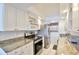 Kitchen features granite countertops, stainless steel appliances, and ample cabinet space at 8931 Blind Pass Rd # 262, St Pete Beach, FL 33706