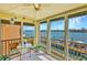 Relaxing enclosed lanai with water views and a cozy sitting area, perfect for enjoying the scenery at 8931 Blind Pass Rd # 262, St Pete Beach, FL 33706