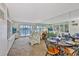 Spacious living and dining area with waterfront views, built-in shelving, and lots of natural light at 8931 Blind Pass Rd # 262, St Pete Beach, FL 33706