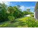 Spacious backyard with lush green lawn and privacy fence, perfect for outdoor activities and relaxation at 9059 Spruce Creek Cir, Riverview, FL 33578