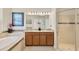 Bathroom featuring a soaking tub, dual vanity, and glass shower at 9059 Spruce Creek Cir, Riverview, FL 33578