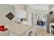 Modern kitchen with quartz countertops, stainless steel appliances, and white cabinetry at 9059 Spruce Creek Cir, Riverview, FL 33578