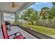 Outdoor lanai with view of the well-manicured yard at 9059 Spruce Creek Cir, Riverview, FL 33578
