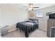 Bedroom with a ceiling fan and a motivational sign on the wall at 9313 Lemon Drop Loop, Ruskin, FL 33573