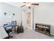 Inviting bedroom showcases neutral walls, ceiling fan and decoratively appointed desk area at 9313 Lemon Drop Loop, Ruskin, FL 33573