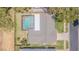 Overhead view of a property with a screened pool, well-maintained landscaping and neighborhood streets at 9930 121 N St, Seminole, FL 33772