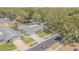 An elevated street-level view of the property featuring a pool and attractive landscaping at 9930 121 N St, Seminole, FL 33772
