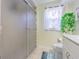 Bathroom featuring frosted glass shower, decorative elements, and tile floors at 9930 121 N St, Seminole, FL 33772