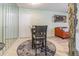 Cozy dining area featuring neutral decor, a mirrored wall, and a round rug at 9930 121 N St, Seminole, FL 33772