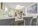 Bright kitchen features a granite countertop, stainless steel appliances, and a unique ceiling light at 9930 121 N St, Seminole, FL 33772
