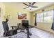 Office space featuring large window, ceiling fan, and modern desk at 9930 121 N St, Seminole, FL 33772