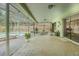 Covered patio featuring brick flooring, comfortable seating, and seamless access to the backyard at 9930 121 N St, Seminole, FL 33772