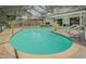 Large screened-in pool area, perfect for relaxation and entertainment, with brick paver decking at 9930 121 N St, Seminole, FL 33772