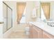 Bathroom with a shower, peach curtains, and sink with a silver faucet at 10002 Colonnade Dr, Tampa, FL 33647