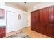 Bedroom with cabinets, white doors, a leaf design, and hardwood floors at 10002 Colonnade Dr, Tampa, FL 33647