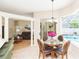 Charming breakfast nook bathed in natural light with a pool view and stylish dining set at 10002 Colonnade Dr, Tampa, FL 33647
