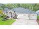 Inviting single-Gathering home with attached two-car garage and a beautiful lawn at 10002 Colonnade Dr, Tampa, FL 33647