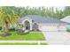 Charming single-story home with mature landscaping and a two-car garage situated on a well-maintained lot at 10002 Colonnade Dr, Tampa, FL 33647