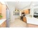 Bright kitchen with stainless steel refrigerator, built-in microwave, and abundant cabinet space at 10002 Colonnade Dr, Tampa, FL 33647