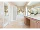 Spacious main bathroom featuring a walk-in shower, bathtub, and vanity at 10002 Colonnade Dr, Tampa, FL 33647