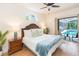 Relaxing main bedroom with a sliding door leading to a screened pool area at 10002 Colonnade Dr, Tampa, FL 33647