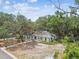Aerial view showcasing the home's location surrounded by lush greenery and mature trees at 103 Hickory Creek Blvd, Brandon, FL 33511