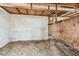 This barn's interior features a aged wooden frame and block walls in need of repair at 103 Hickory Creek Blvd, Brandon, FL 33511
