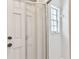 Bathroom featuring tiled walls, window, and shower with door at 103 Hickory Creek Blvd, Brandon, FL 33511