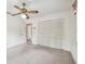 Bedroom featuring neutral carpet, a closet, and an attached bathroom at 103 Hickory Creek Blvd, Brandon, FL 33511