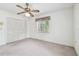 Bedroom with ceiling fan, neutral carpet, and a large closet at 103 Hickory Creek Blvd, Brandon, FL 33511
