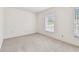 Bright bedroom with neutral carpet, and a large window at 103 Hickory Creek Blvd, Brandon, FL 33511