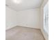 Bright, empty bedroom featuring neutral carpet, and a large window at 103 Hickory Creek Blvd, Brandon, FL 33511