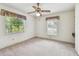 Bedroom with a ceiling fan, neutral carpet, and a large window at 103 Hickory Creek Blvd, Brandon, FL 33511