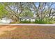 Charming single-story home with mature trees and landscaped front yard along street at 103 Hickory Creek Blvd, Brandon, FL 33511