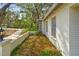 Well-maintained white brick exterior with manicured landscaping surrounding the home's foundation at 103 Hickory Creek Blvd, Brandon, FL 33511