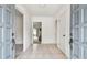 Light and airy foyer with neutral tile flooring, offering a view into other rooms at 103 Hickory Creek Blvd, Brandon, FL 33511