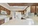 A kitchen with wood cabinets and white appliances with tile flooring at 103 Hickory Creek Blvd, Brandon, FL 33511