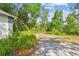 Natural landscaping featuring mature plants and trees alongside the home at 103 Hickory Creek Blvd, Brandon, FL 33511