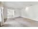 Spacious living room featuring neutral carpet, large windows with curtains, and recessed lighting at 103 Hickory Creek Blvd, Brandon, FL 33511