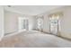 Inviting living room featuring natural light from large windows, and a view of the front door at 103 Hickory Creek Blvd, Brandon, FL 33511