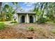Outdoor building featuring dual doors, adding potential for storage or workshop space at 103 Hickory Creek Blvd, Brandon, FL 33511