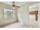 A room with neutral walls, tile flooring, a window, and a ceiling fan at 103 Hickory Creek Blvd, Brandon, FL 33511