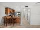 Spacious eat-in kitchen featuring granite countertops, wood cabinetry and an eat in breakfast bar at 108 Biscayne Ave # B, Tampa, FL 33606