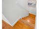 A bright staircase with wood treads ascends, complemented by a white wall and decorative wall art at 108 Biscayne Ave # B, Tampa, FL 33606