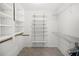 Walk-in closet with multiple shelves and rods for organizing clothes, and tile flooring at 108 Biscayne Ave # B, Tampa, FL 33606