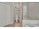 Bathroom with shower and tub and linen closet at 10945 Sundrift Dr, Tampa, FL 33647