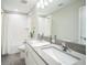 Modern bathroom featuring double sinks, modern fixtures, and plenty of counter space at 10945 Sundrift Dr, Tampa, FL 33647